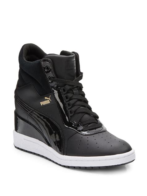 black leather wedge sneakers .